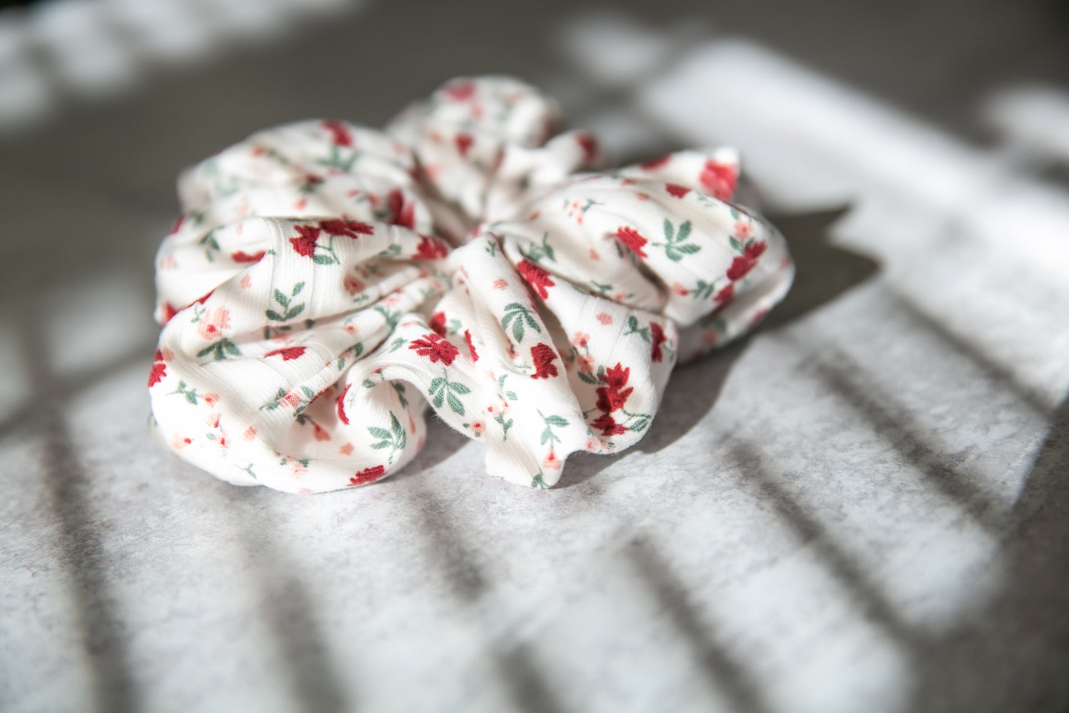 White scrunchie with red floral pattern